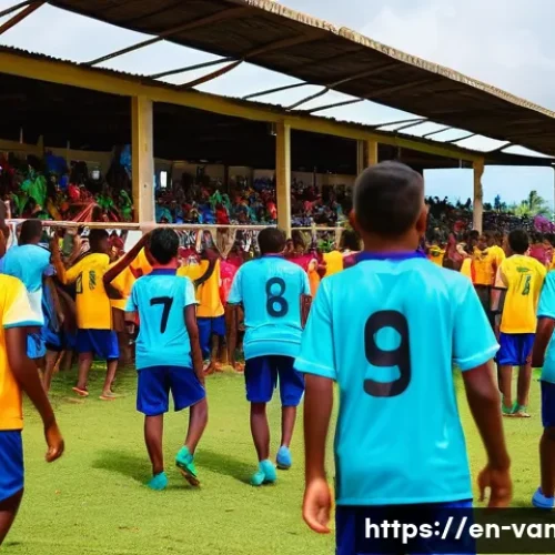 Home 33 바누아투의 축구 리그 - A vibrant local football match scene in a small island community stadium during daytime, featuring d...